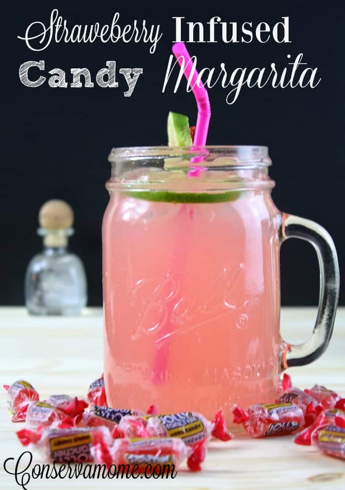 A delicious and easy recipe for Strawberry Infused Candy Margarita. The perfect drink for summer or when you need to ream of summer.