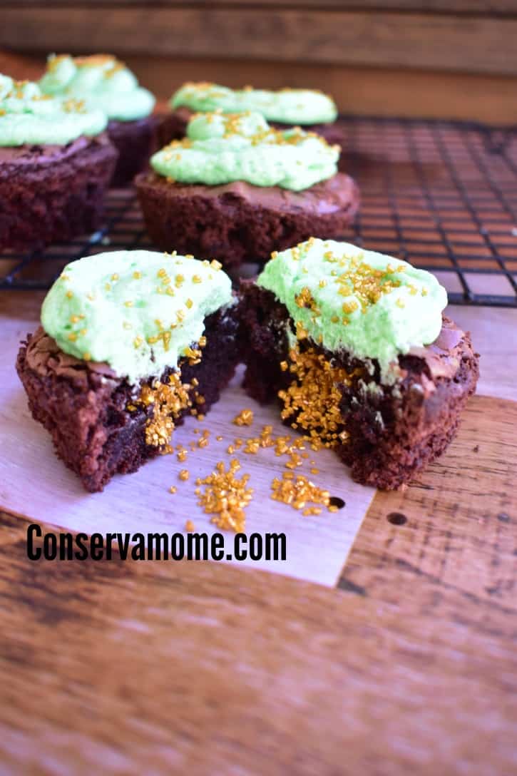 These delicious Pot-O-Gold Brownie Cupcakes are the perfect St.Patrick's Day Dessert! will be a hit at any fun St.Patrick's day event. Made with deliciousness and filled with a magical surprise these will be a fun treat for everyone to enjoy.