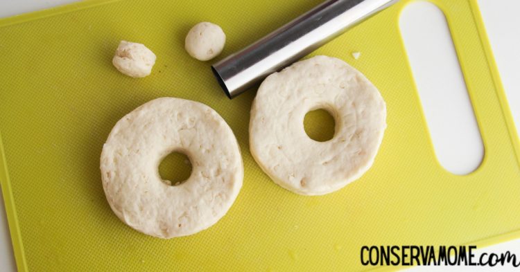 cutting out donuts in dough