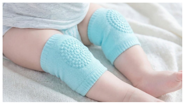 Close-up of baby knees wearing anti-slip silicone knee pads for crawling grip